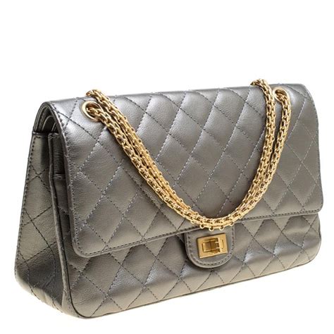 chanel 2.55 facts|Chanel quilted reissue shoulder bag.